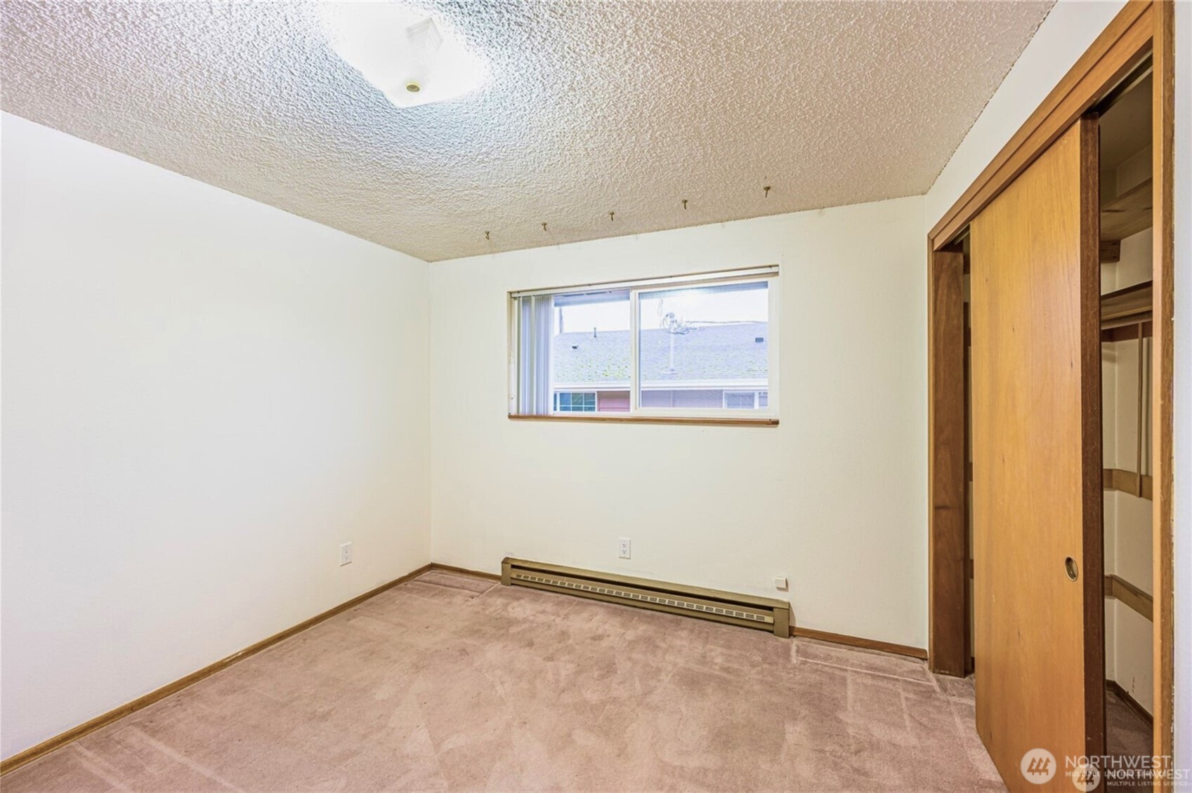 1030 11th Street Port Townsend, WA 98368 - Photo 10 of 21 an empty room with a empty space and a window