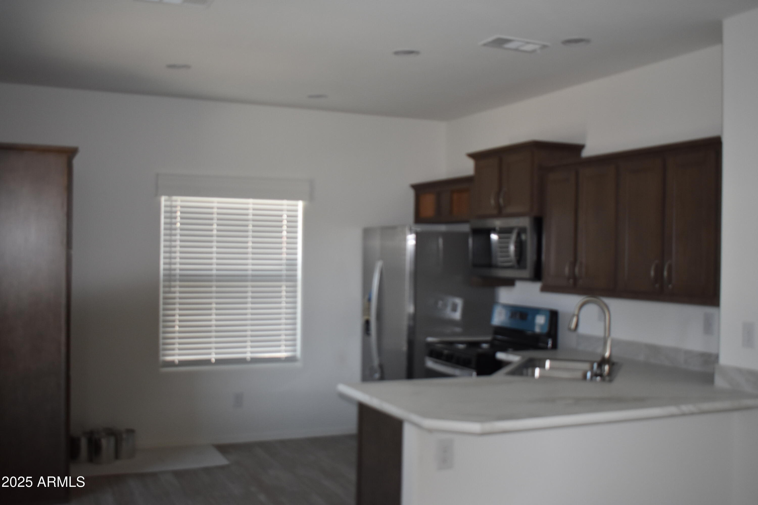 620 West Limberlost Drive, Unit E3 Tucson, AZ 85705 - Photo 3 of 17 a bathroom with a sink and a mirror