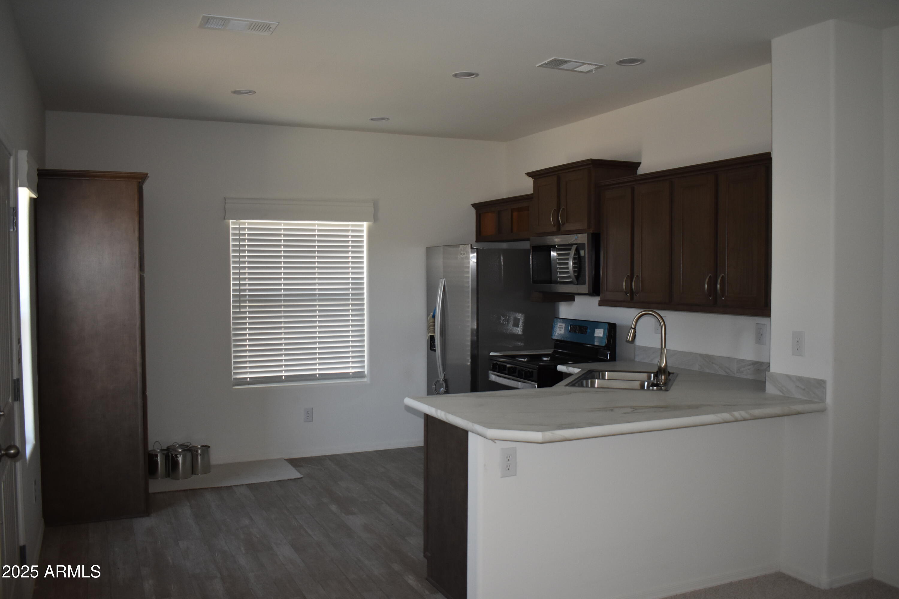 620 West Limberlost Drive, Unit E3 Tucson, AZ 85705 - Photo 4 of 17 a room with cabinets and appliances