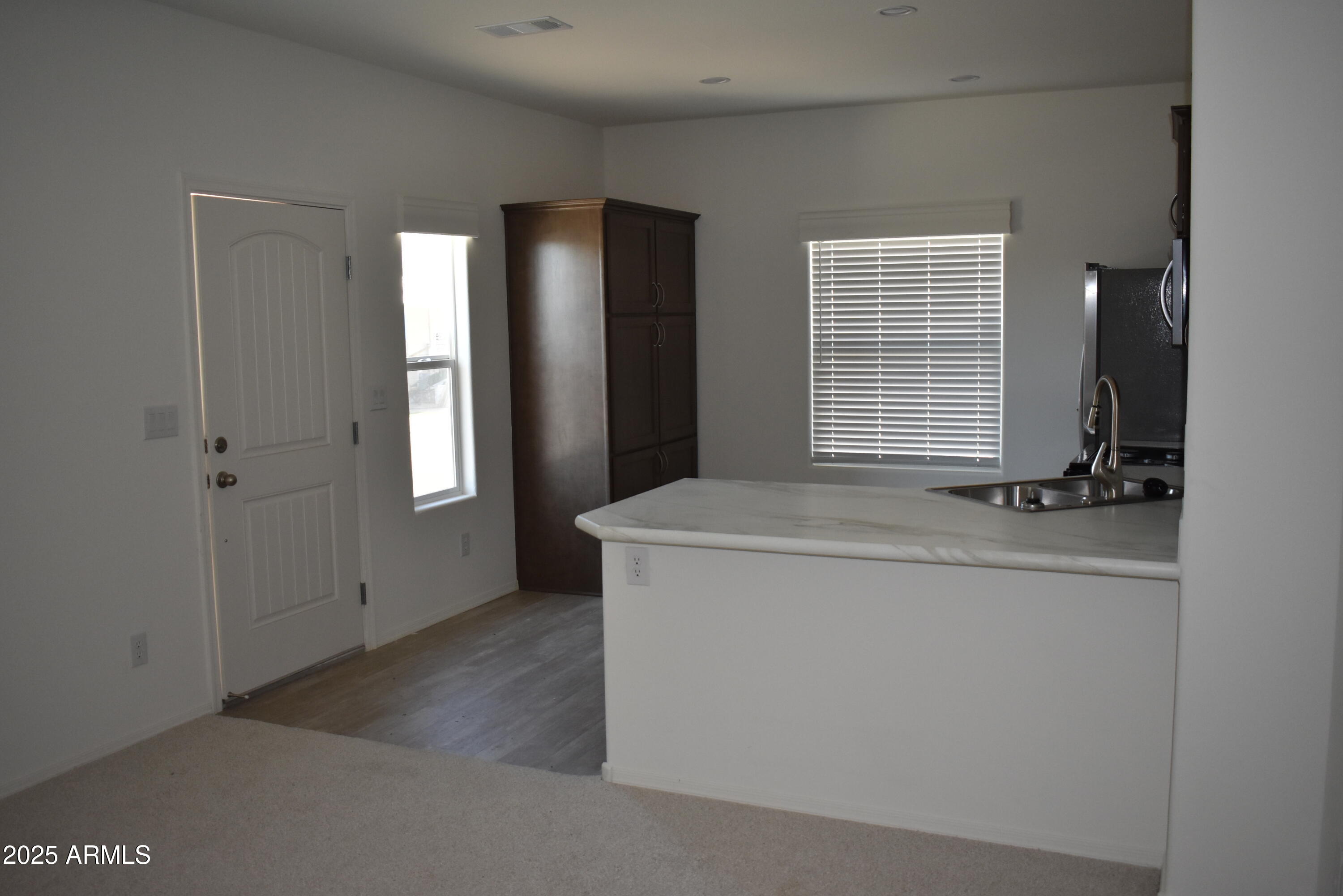 620 West Limberlost Drive, Unit E3 Tucson, AZ 85705 - Photo 5 of 17 a view of an empty room with a window