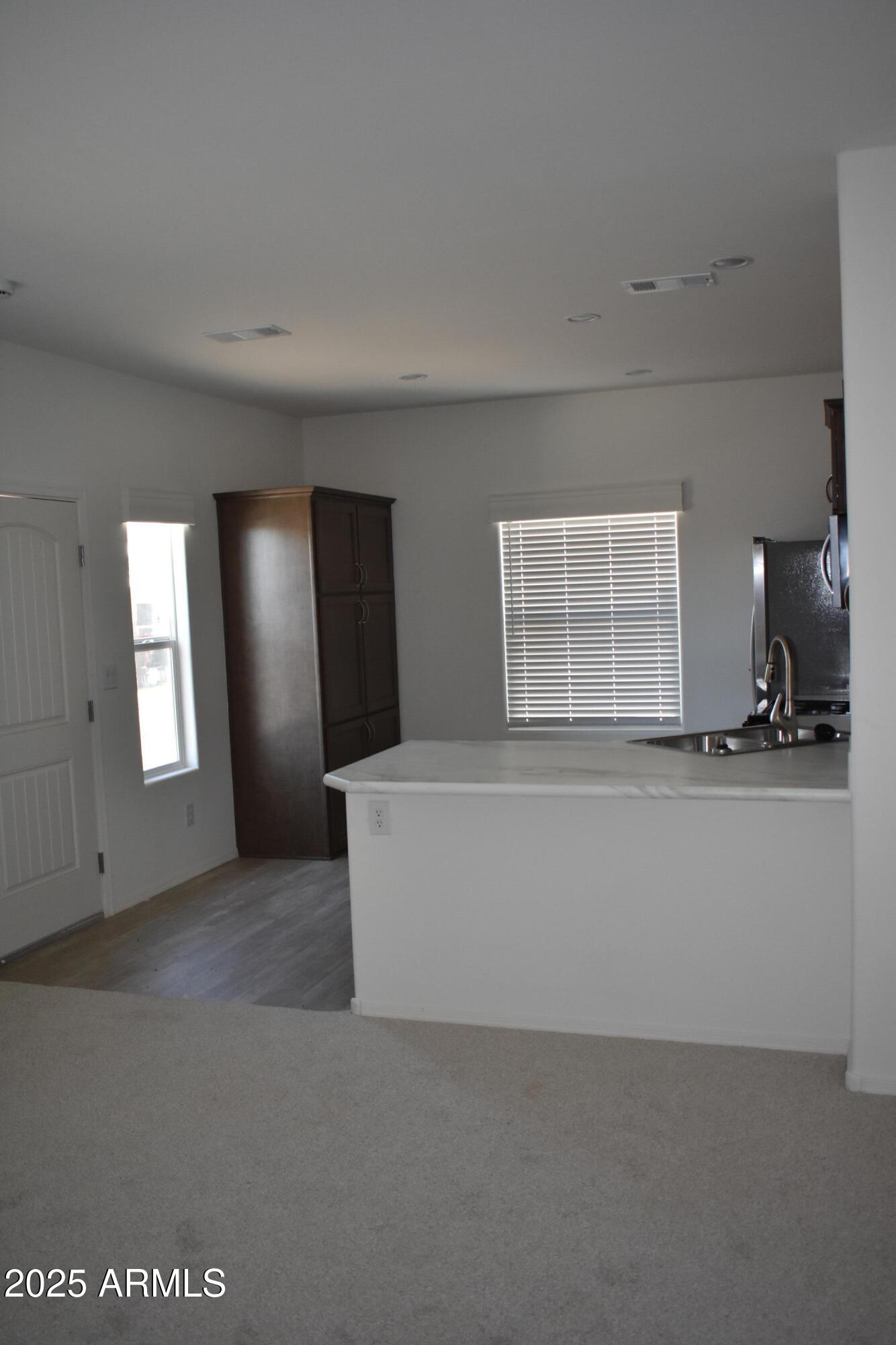 620 West Limberlost Drive, Unit E3 Tucson, AZ 85705 - Photo 7 of 17 an empty room with windows