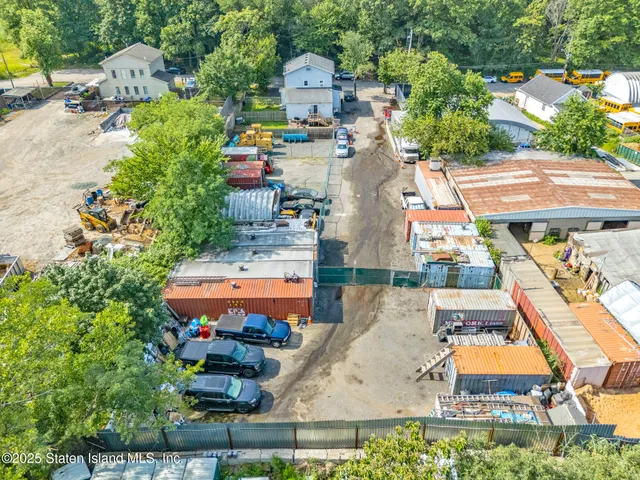 an aerial view of a house with outdoor space