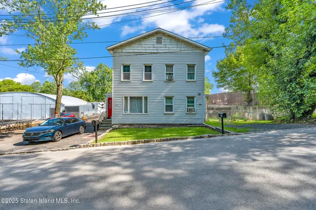 a car parked in front of a house