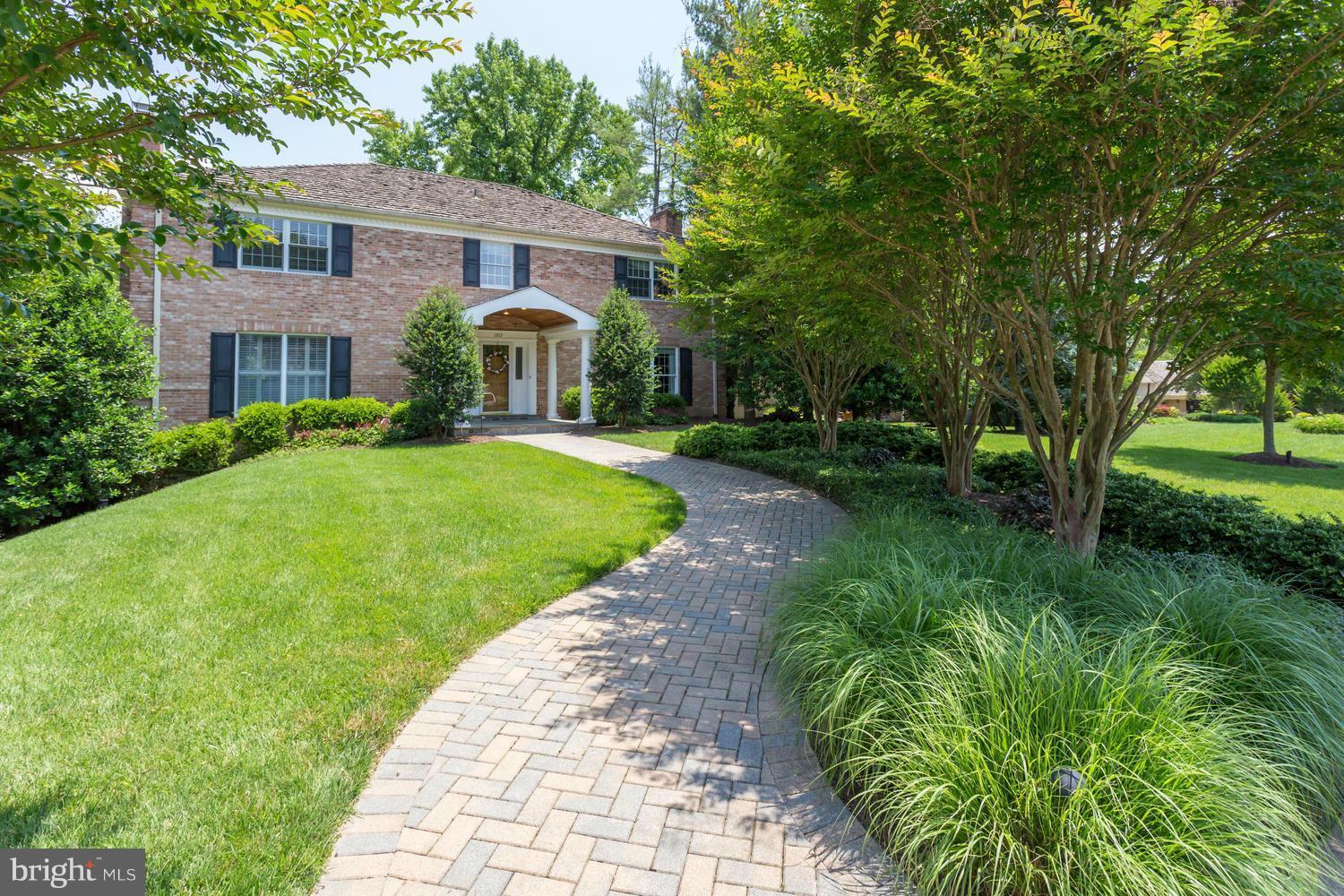 1203 Potomac School Road McLean, VA 22101 - Photo 1 of 1 a front view of a house with garden