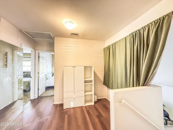 a view of entryway with wooden floor