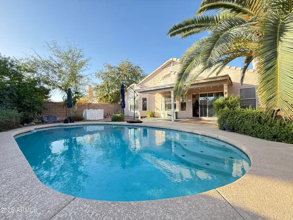 a view of a house with swimming pool