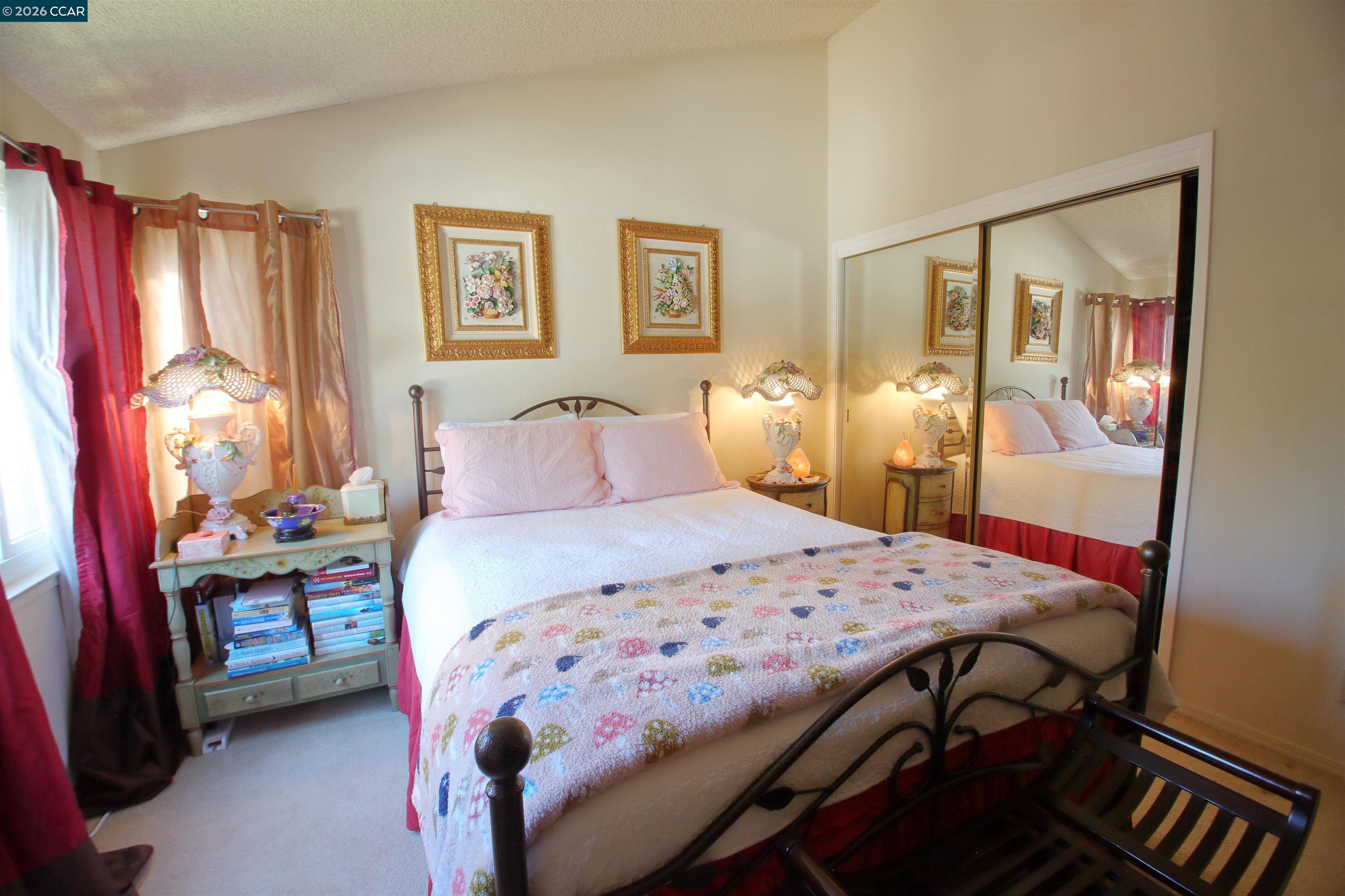 3901 Clayton Road, Unit 25 Concord, CA 94521 - Photo 13 of 28 a bedroom with a bed and wooden floor