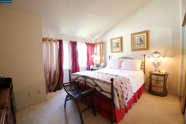 a view of a house with a wooden fence