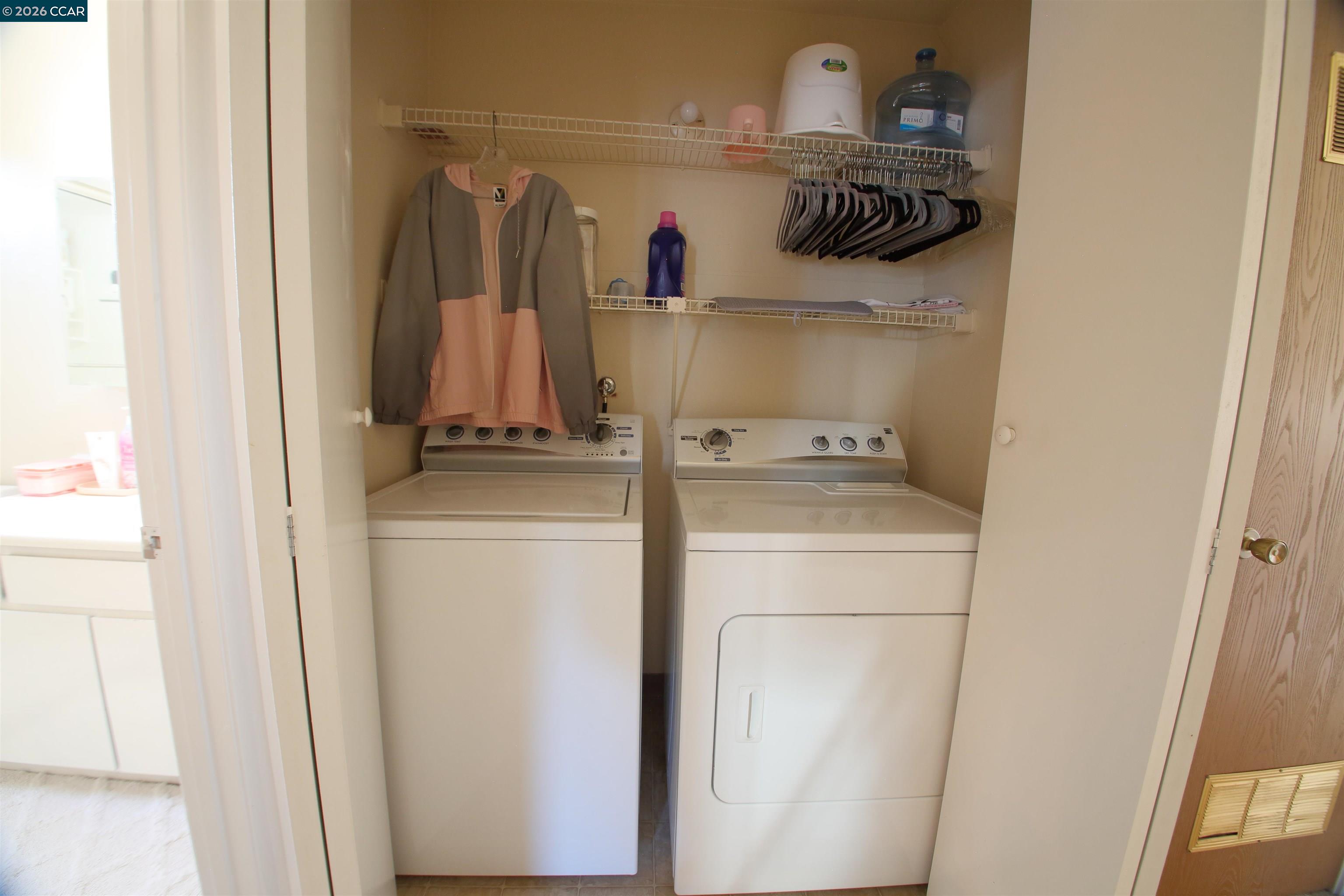 3901 Clayton Road, Unit 25 Concord, CA 94521 - Photo 17 of 28 a view of walk in closet with clothes and shoes