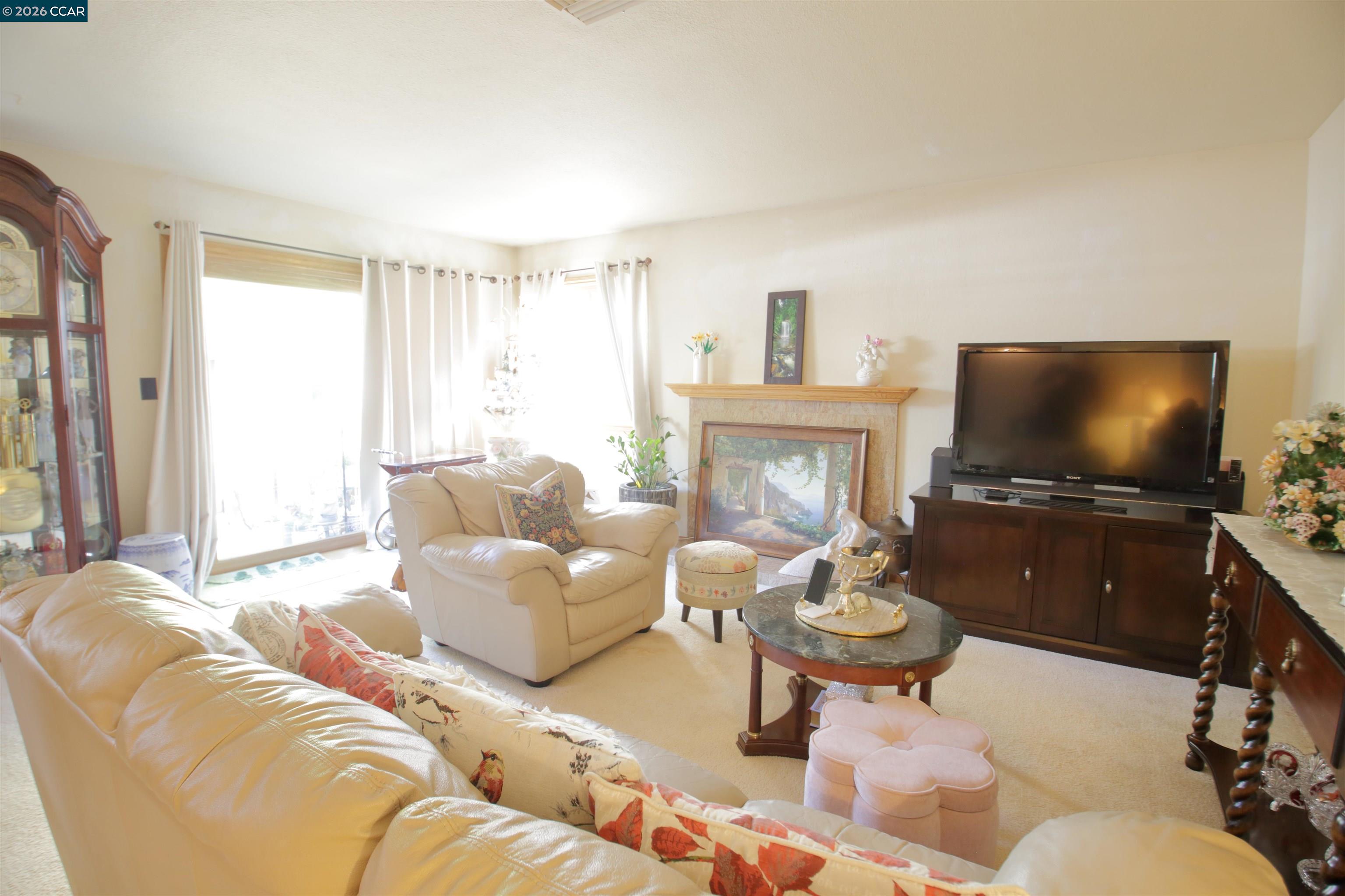 3901 Clayton Road, Unit 25 Concord, CA 94521 - Photo 24 of 28 a living room with furniture and a flat screen tv