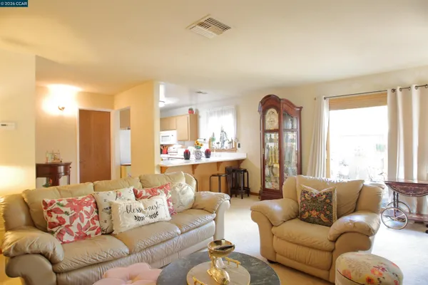 a kitchen with a sink cabinets and window