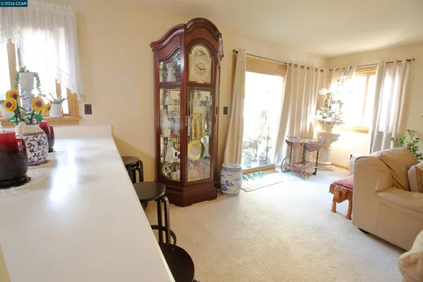a kitchen with sink refrigerator and window