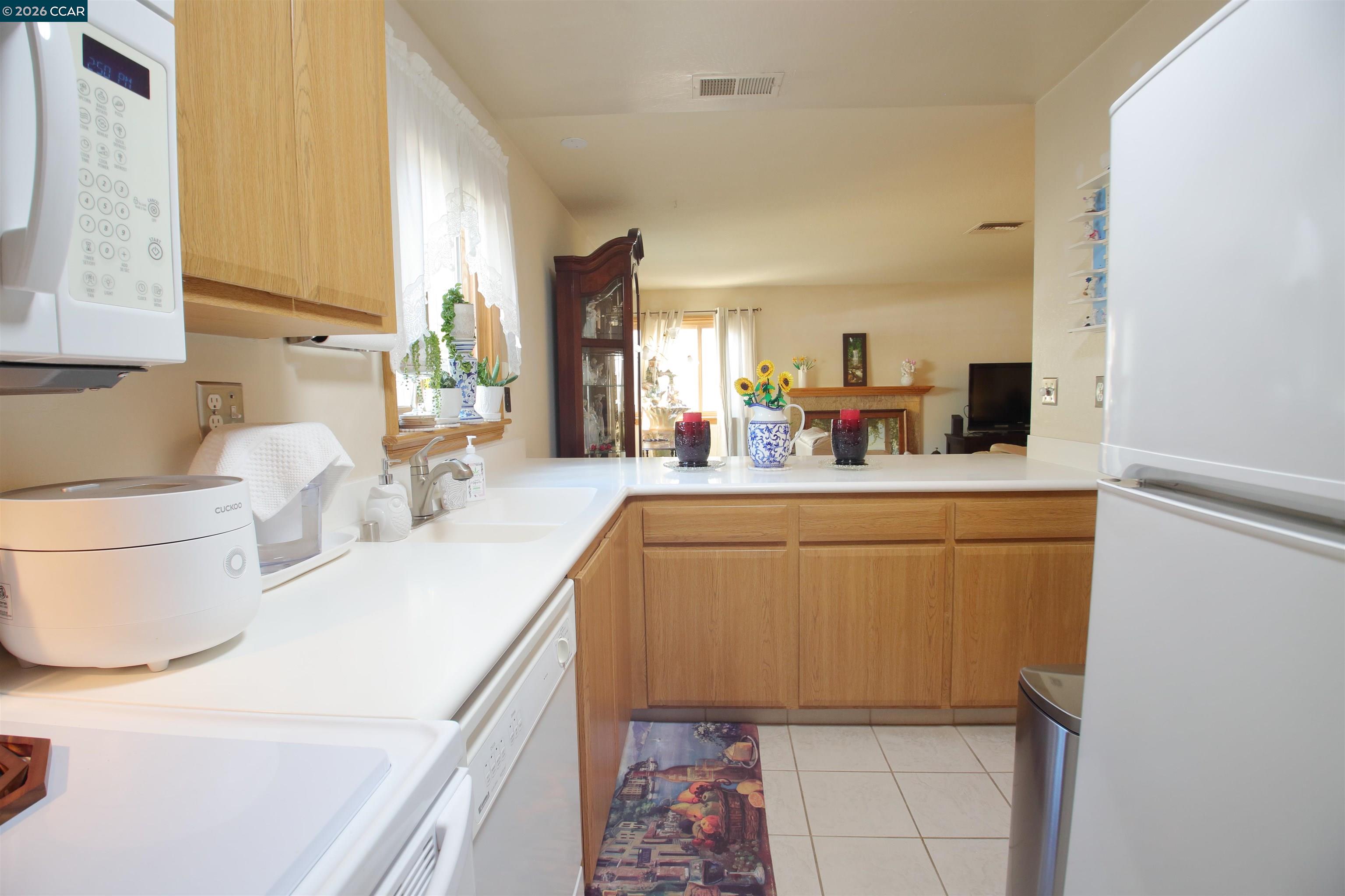 3901 Clayton Road, Unit 25 Concord, CA 94521 - Photo 5 of 28 a kitchen with a sink appliances and cabinets