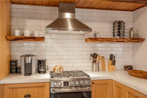 a kitchen with a stove and cabinets