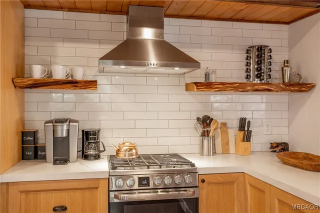 a kitchen with a stove and cabinets