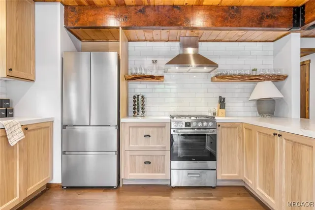 a kitchen with stainless steel appliances and white cabinets