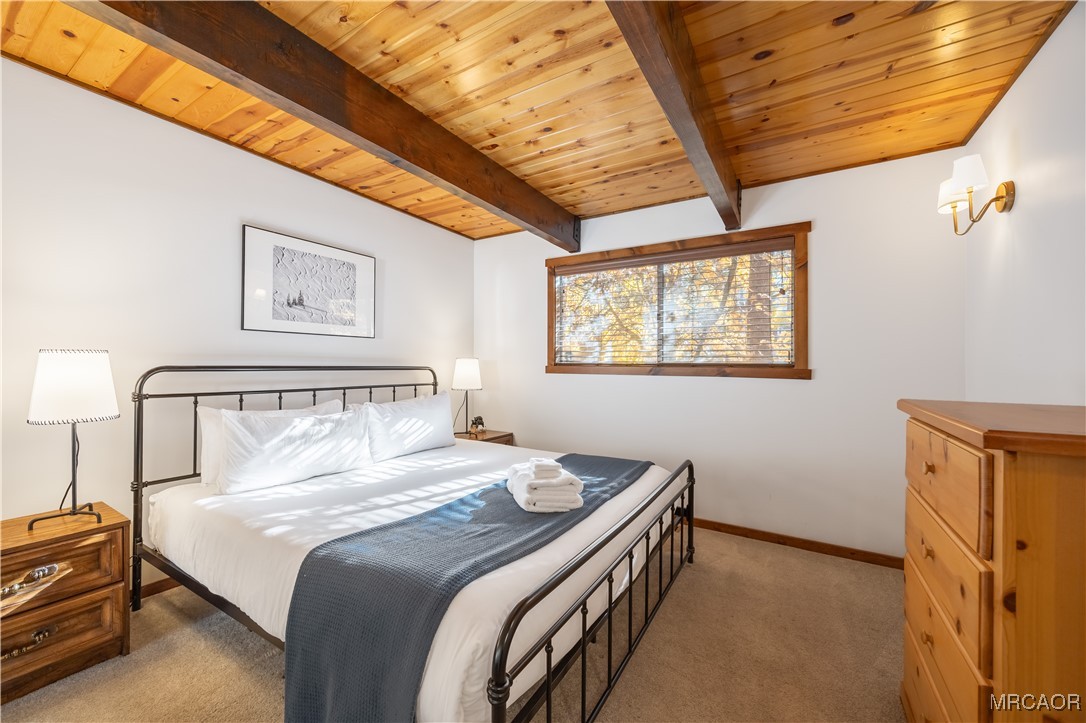 42535 Avalon Road Big Bear Lake, CA 92315 - Photo 22 of 39 a bedroom with a bed and a dresser next to a window