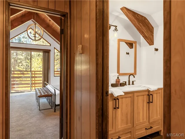 a en suite bathroom with a sink and a mirror