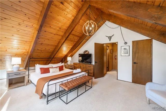 a bedroom with furniture and a wooden floor