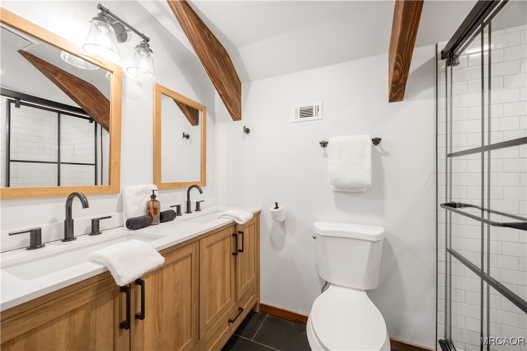 42535 Avalon Road Big Bear Lake, CA 92315 - Photo 34 of 39 a bathroom with a toilet sink and mirror