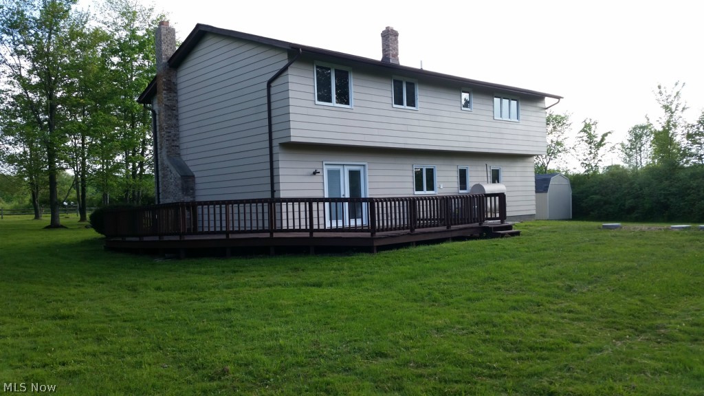 5073 Wayne Road Mantua, OH 44255 - Photo 2 of 25 French doors on the lower level open from the family room to a large deck and backyard