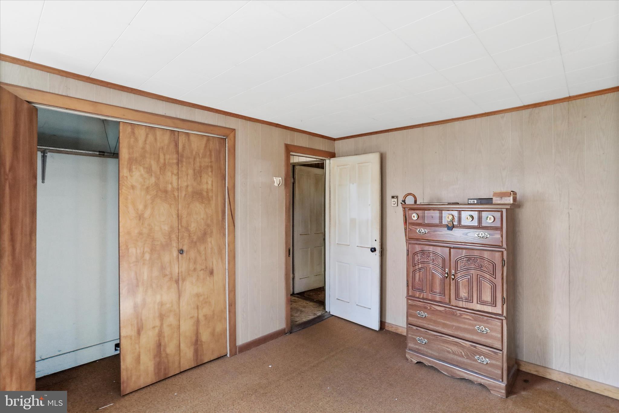 301 Poplar Street Westernport, MD 21562 - Photo 14 of 22 a view of walk in closet with empty racks