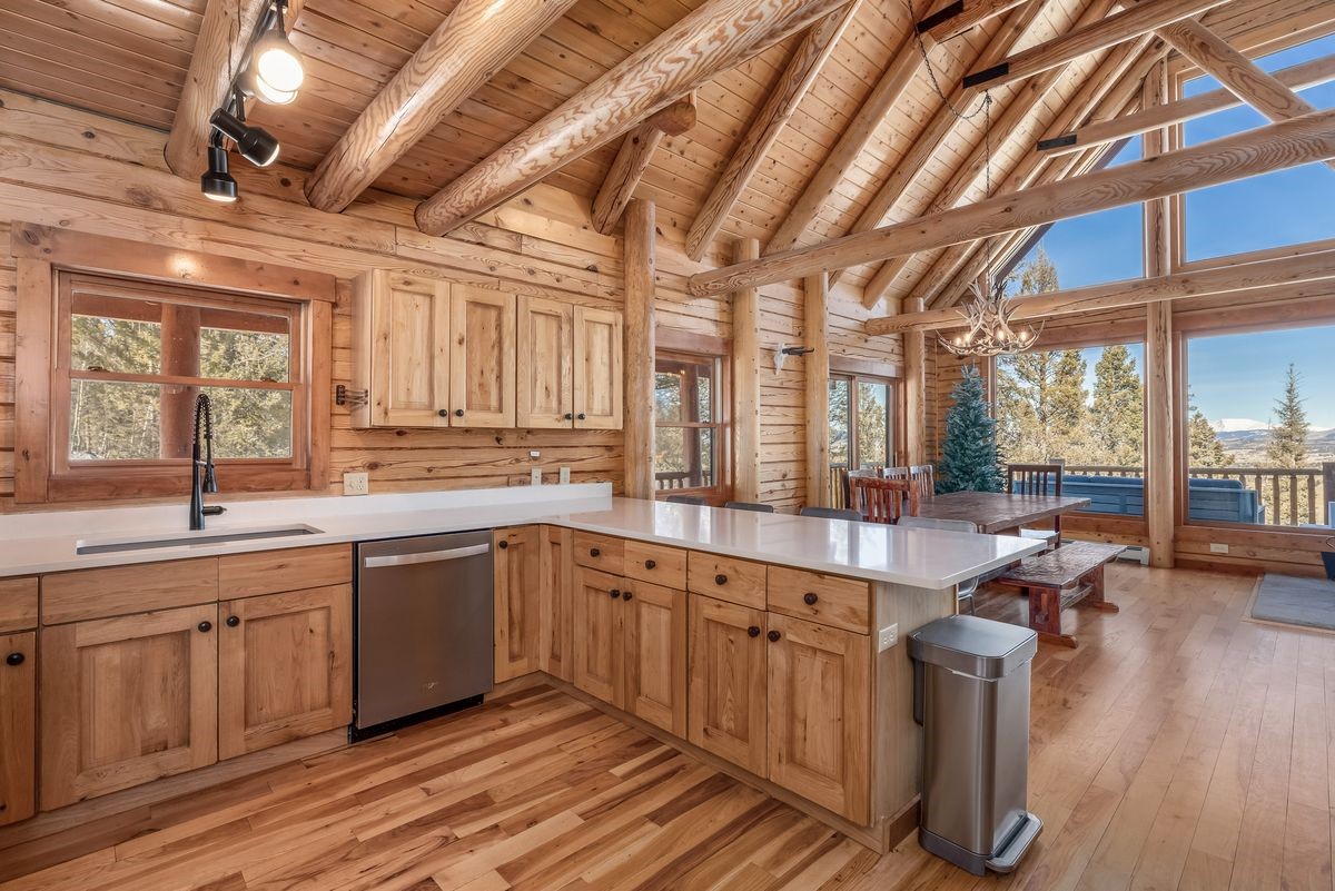 999 Bowstring Como, CO 80456 - Photo 11 of 37 a large kitchen with a large window and stainless steel appliances