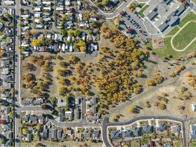 an aerial view of residential building and parking space