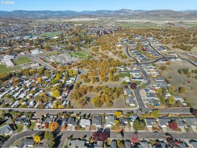 an aerial view of residential building and outdoor space