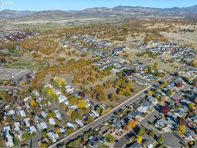an aerial view of residential house and outdoor space