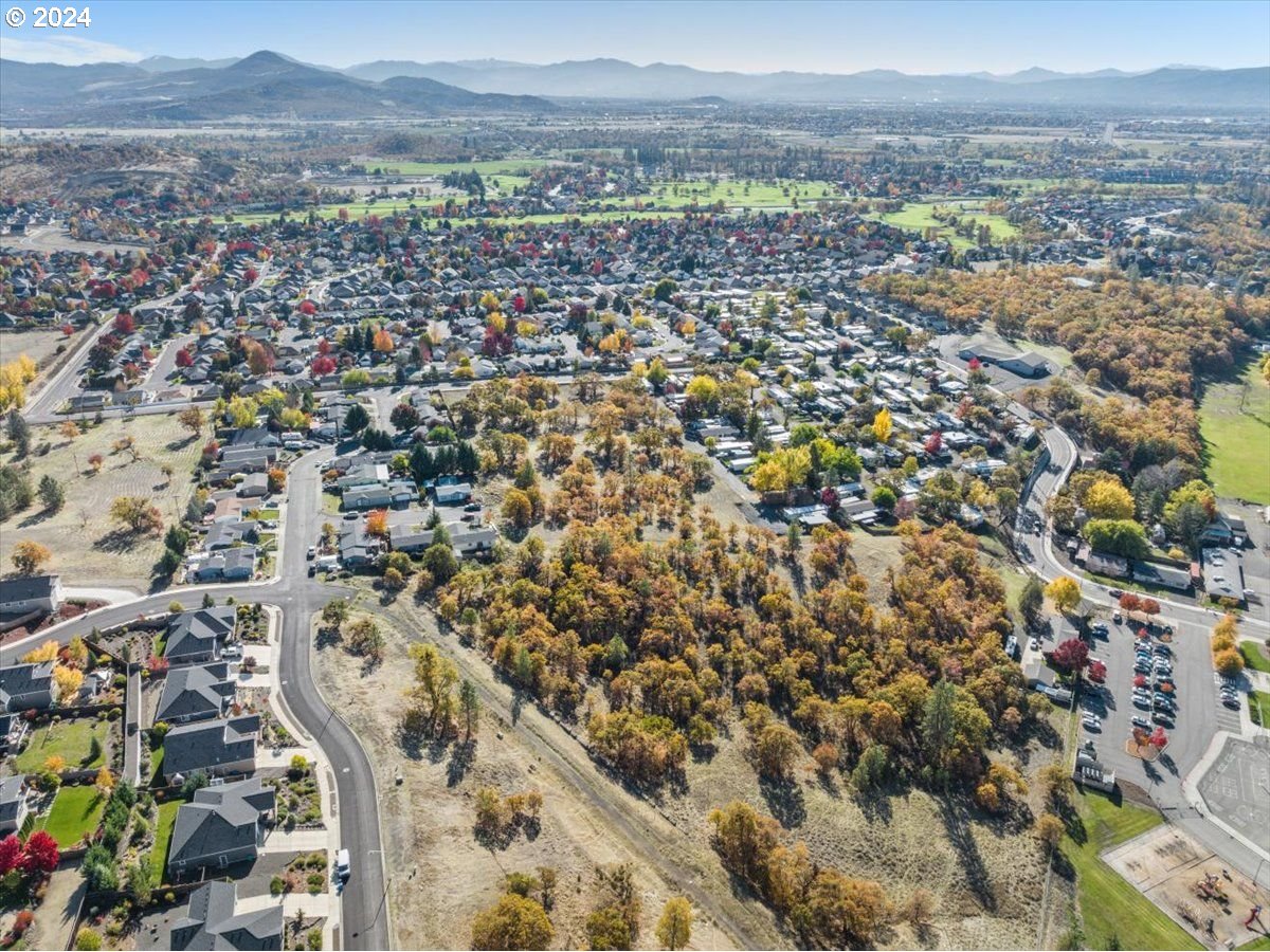 Stevens Road Eagle Point, OR 97524 - Photo 9 of 13 an aerial view of residential houses with outdoor space