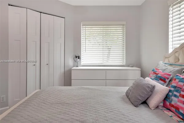a view of a workspace with furniture and wooden floor