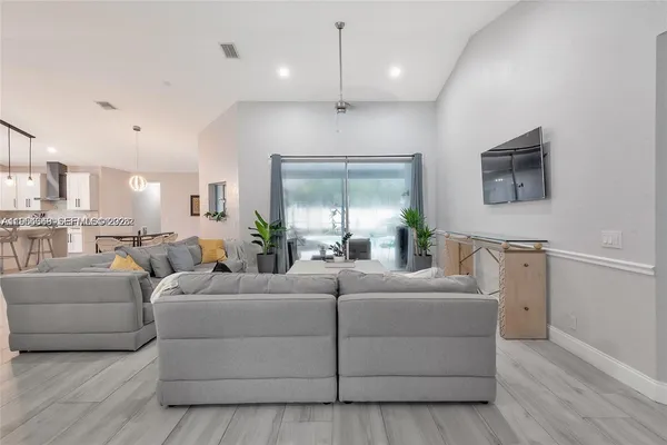 a living room with furniture and a large window