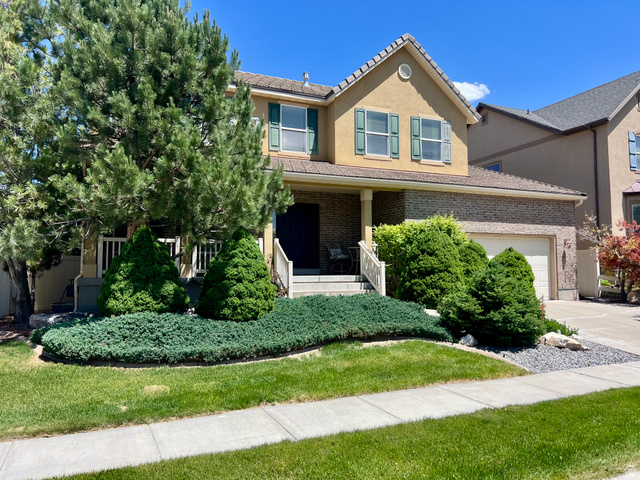 369 Culross Circle Tooele, UT 84074 - Photo 48 of 54 Stucco and brick exterior with a prominent gabled roofline