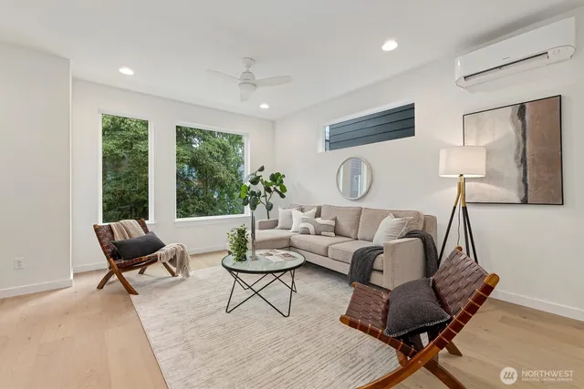 a living room with furniture and a large window