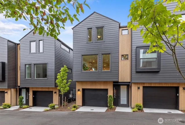 a front view of a house with a garage