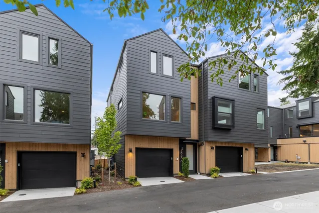 a front view of a house with a street