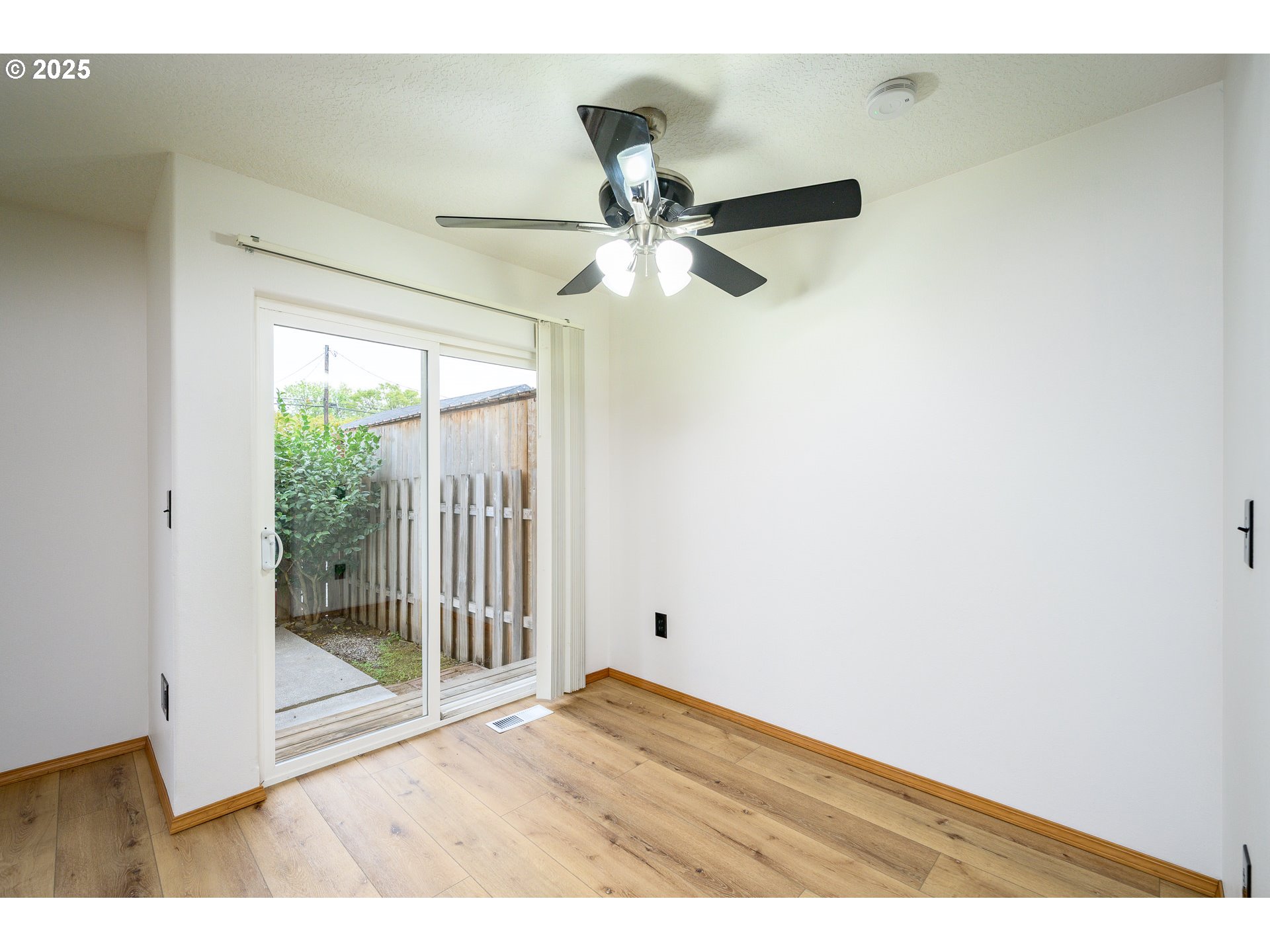 1306 Parkside Lane Newberg, OR 97132 - Photo 11 of 48 a view of empty room with wooden floor and fan