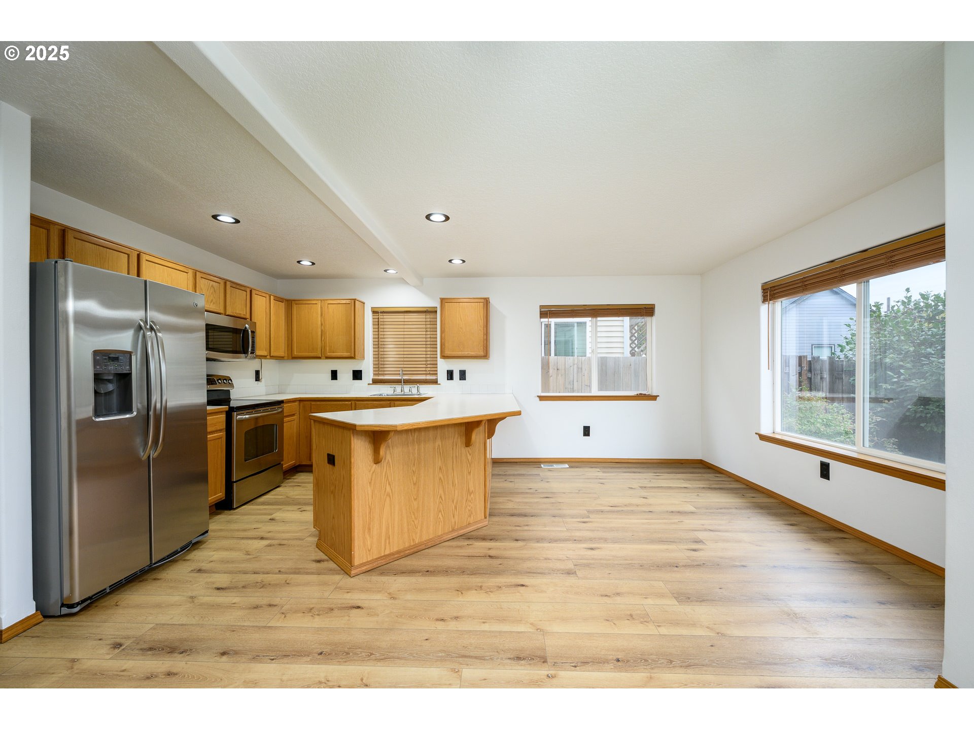 1306 Parkside Lane Newberg, OR 97132 - Photo 13 of 48 a large white kitchen with a large window