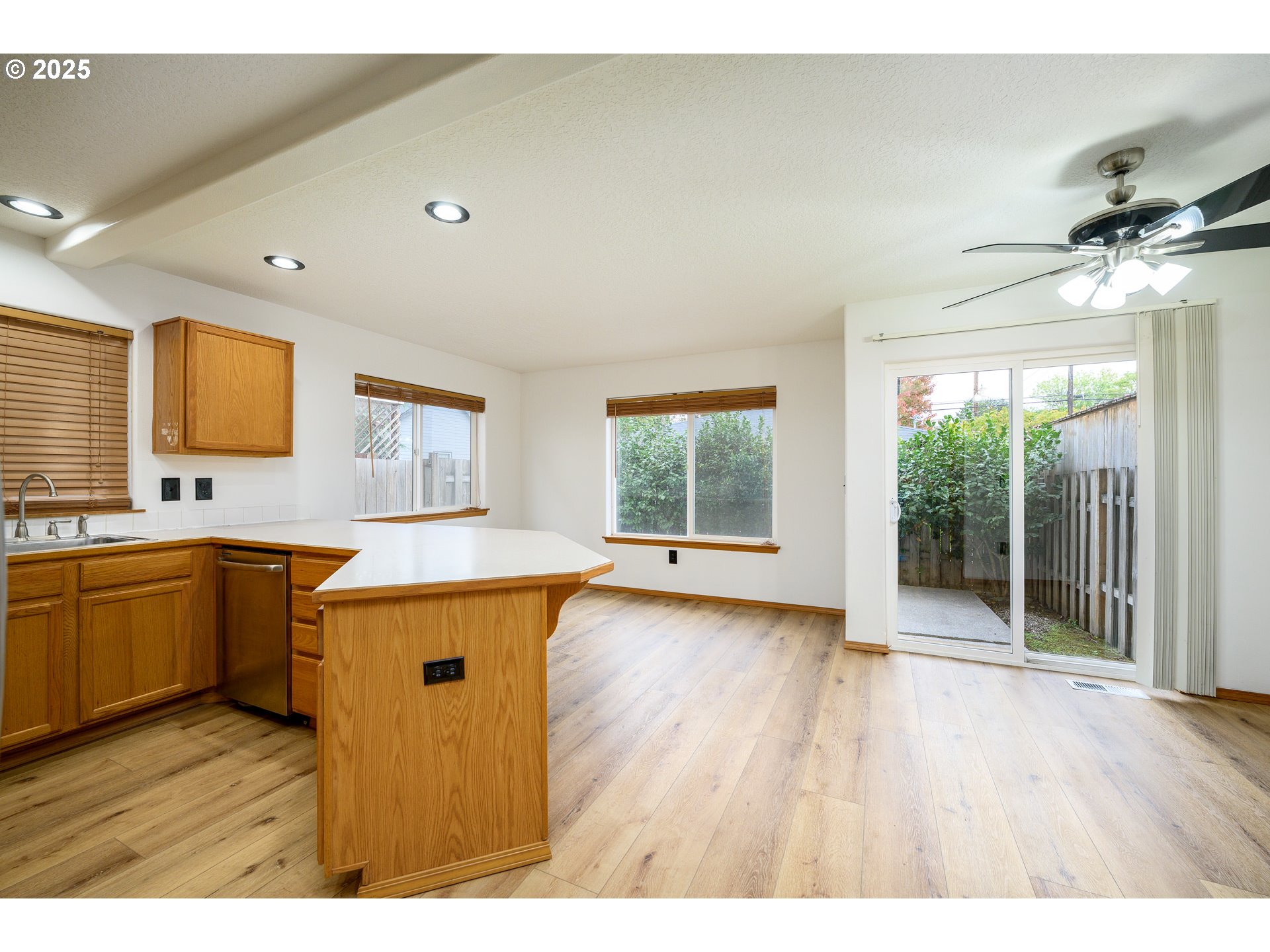 1306 Parkside Lane Newberg, OR 97132 - Photo 14 of 48 a view of a kitchen with a sink wooden floor and a window