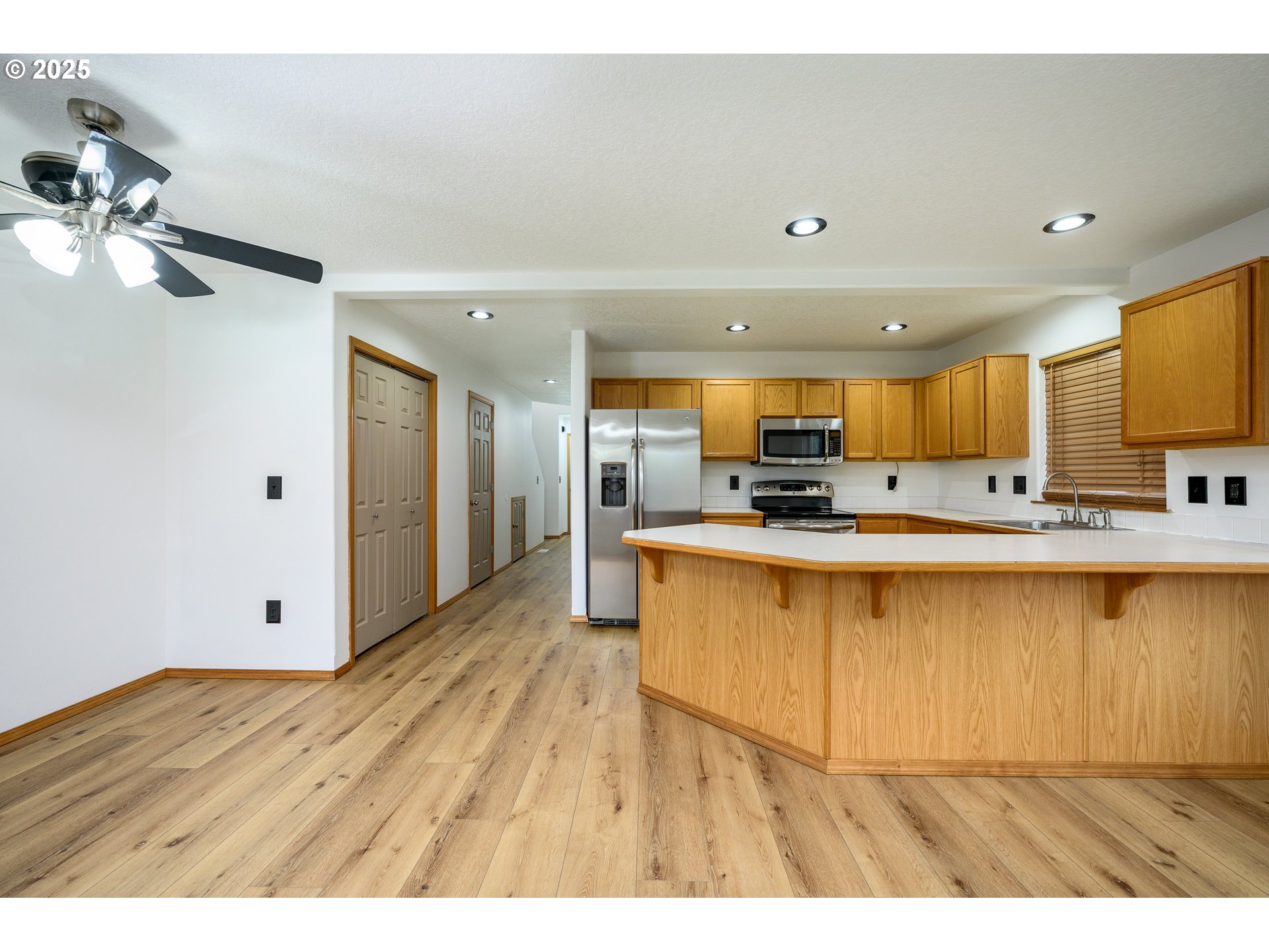 1306 Parkside Lane Newberg, OR 97132 - Photo 15 of 48 a view of kitchen with stainless steel appliances kitchen island sink stove and refrigerator