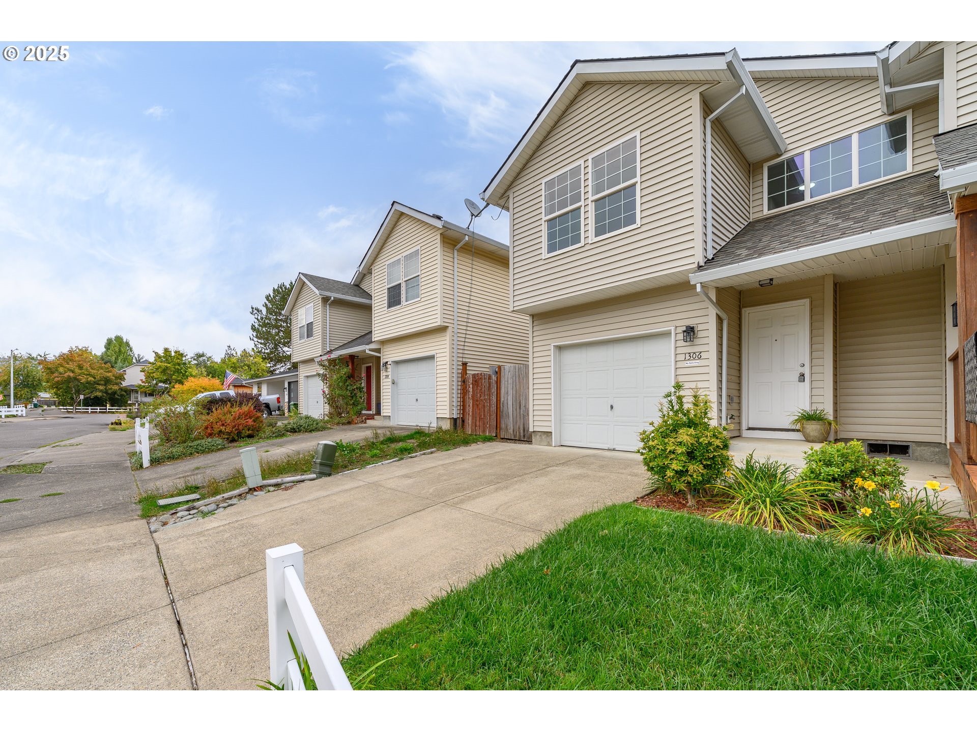 1306 Parkside Lane Newberg, OR 97132 - Photo 44 of 48 a front view of a house with a yard and garage