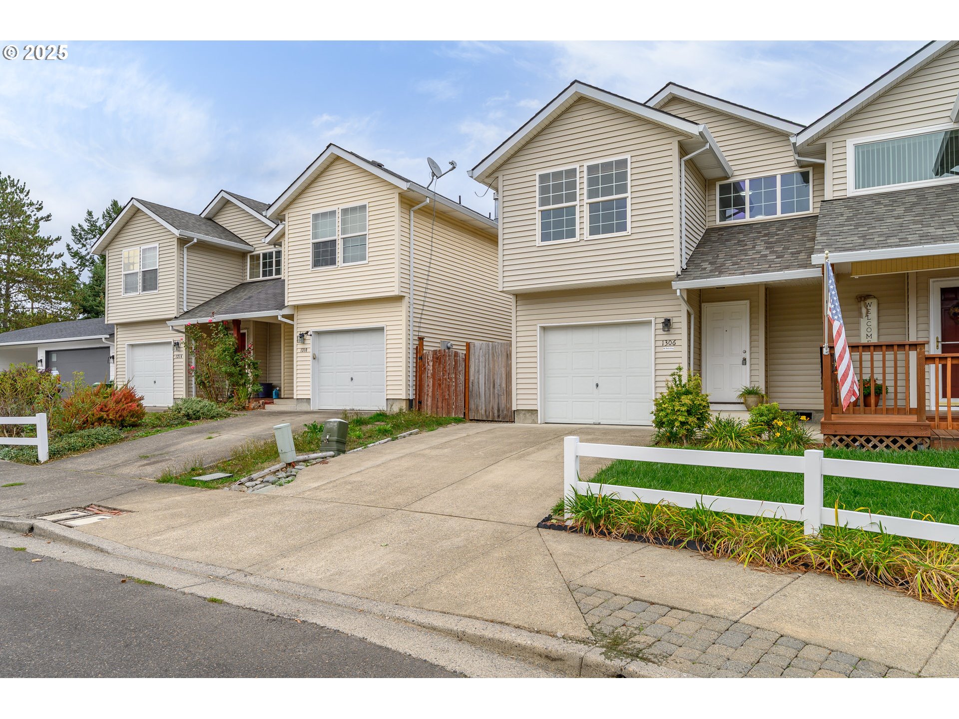 1306 Parkside Lane Newberg, OR 97132 - Photo 45 of 48 a front view of a house with a yard and garage