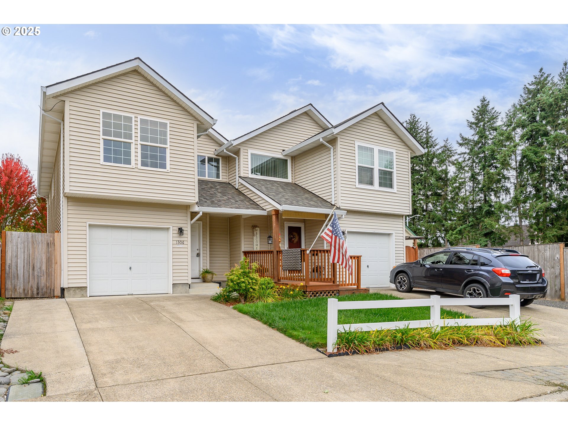 1306 Parkside Lane Newberg, OR 97132 - Photo 47 of 48 a view of a white house with a small yard and large tree