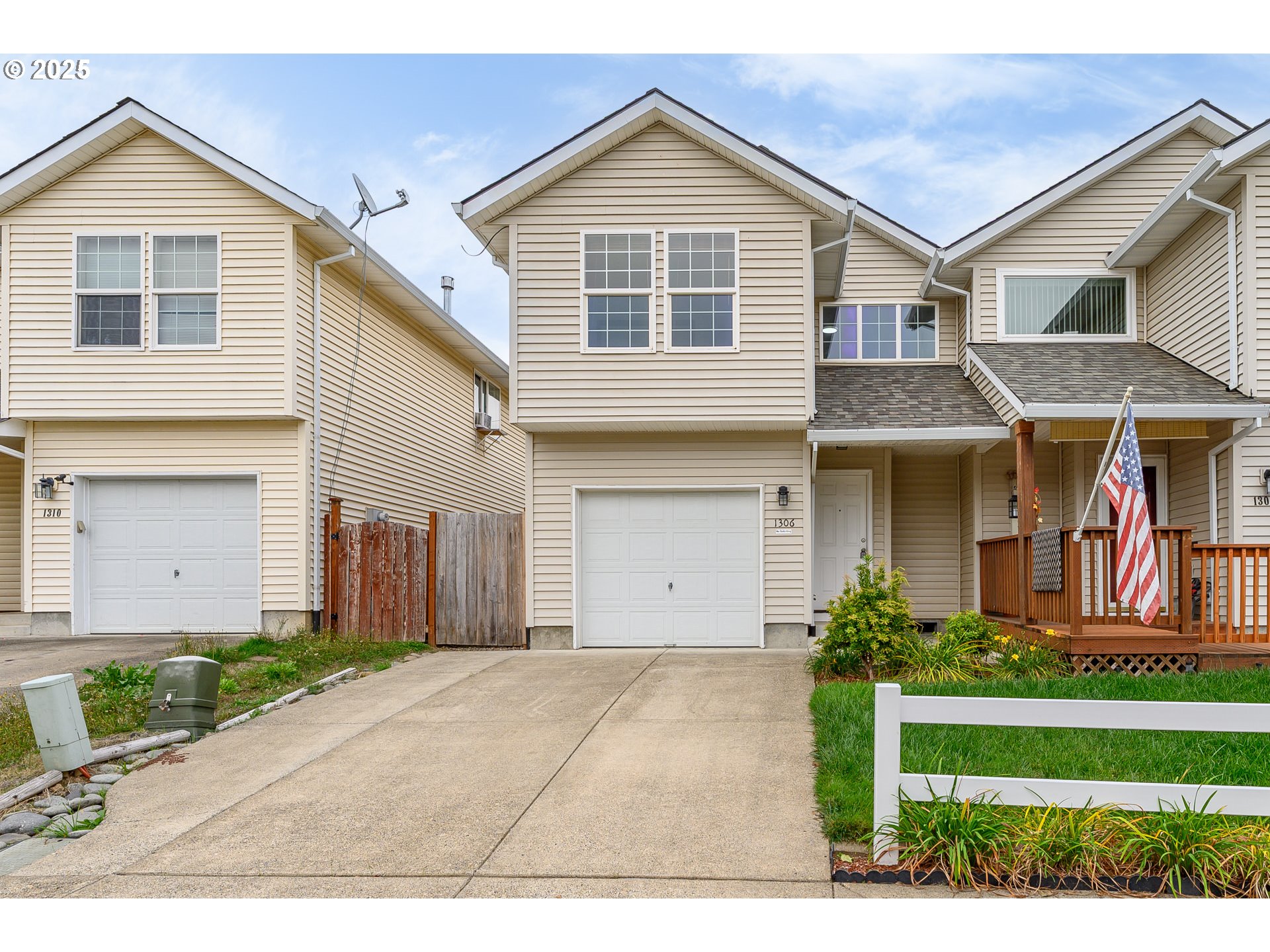 1306 Parkside Lane Newberg, OR 97132 - Photo 48 of 48 a front view of a house with a yard and garage