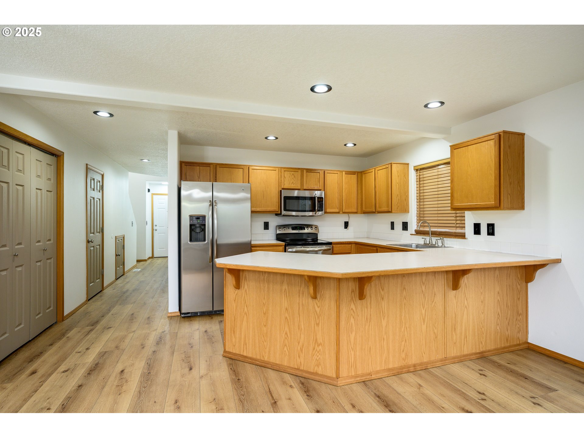 1306 Parkside Lane Newberg, OR 97132 - Photo 5 of 48 a view of kitchen with stainless steel appliances granite countertop sink stove and refrigerator
