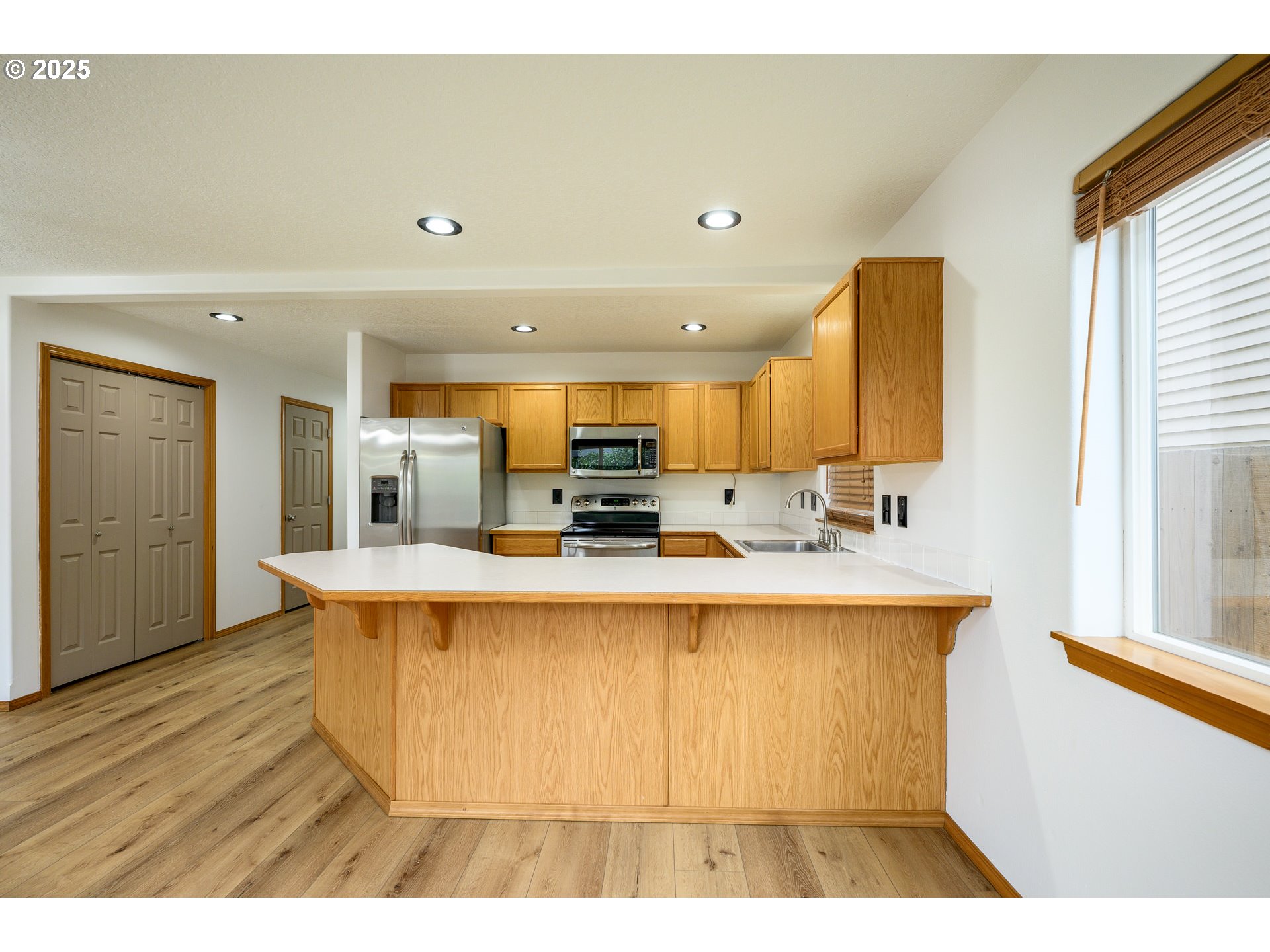 1306 Parkside Lane Newberg, OR 97132 - Photo 7 of 48 a view of kitchen with stainless steel appliances granite countertop a sink and cabinets
