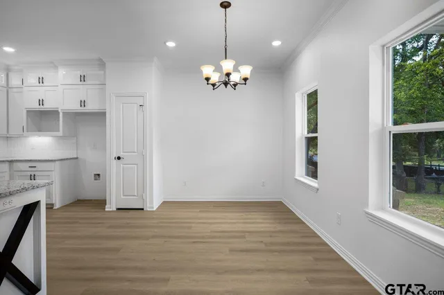 a view of a kitchen with marble kitchen and stainless steel appliances