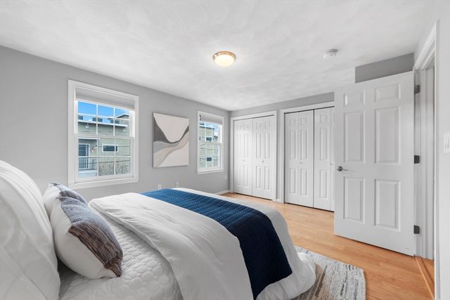 a bed room with a bed and a window