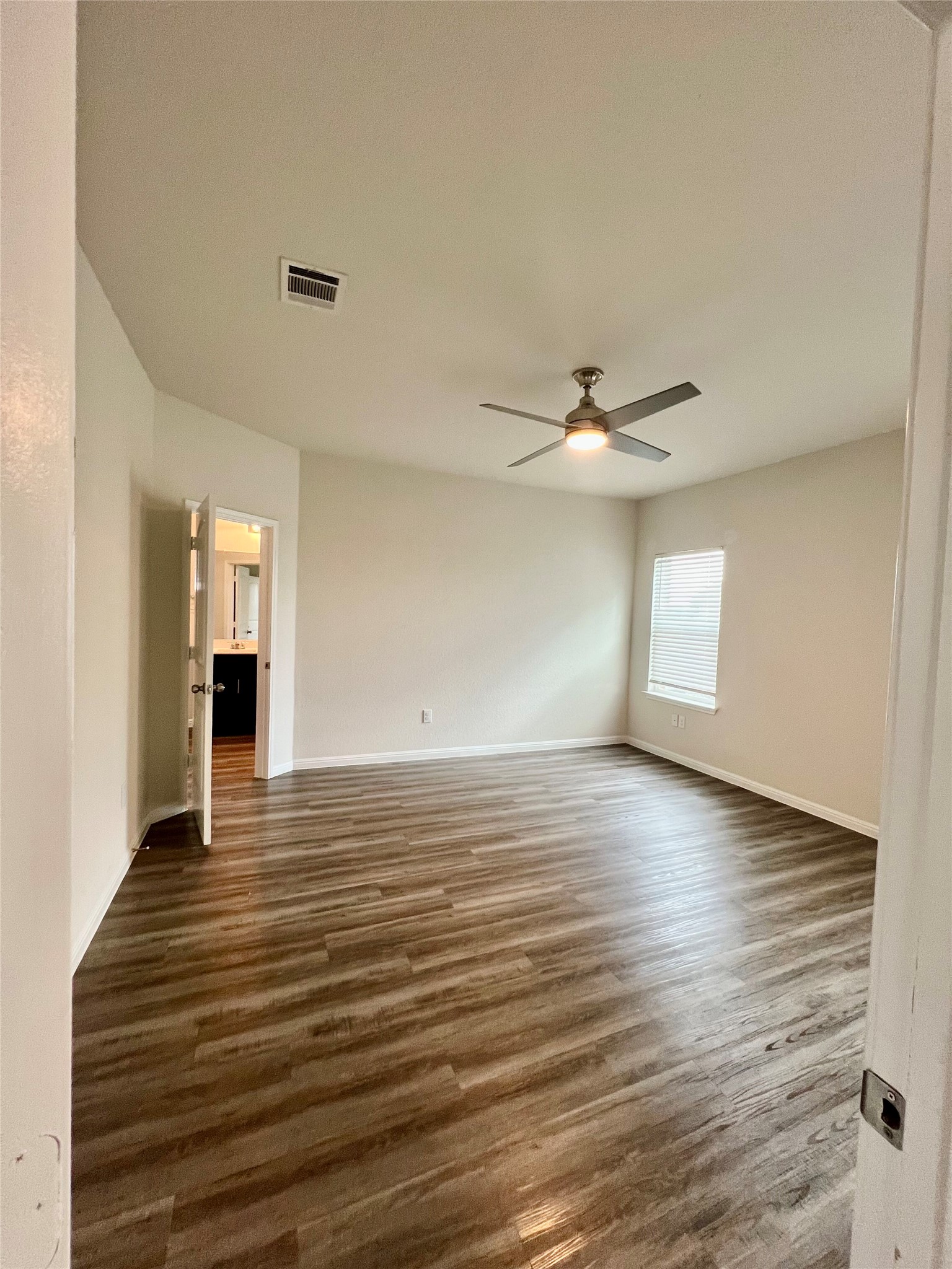 104 Moravia Road Georgetown, TX 78626 - Photo 19 of 36 A generously sized room with resilient flooring offers a welcoming blank canvas for your design dreams.